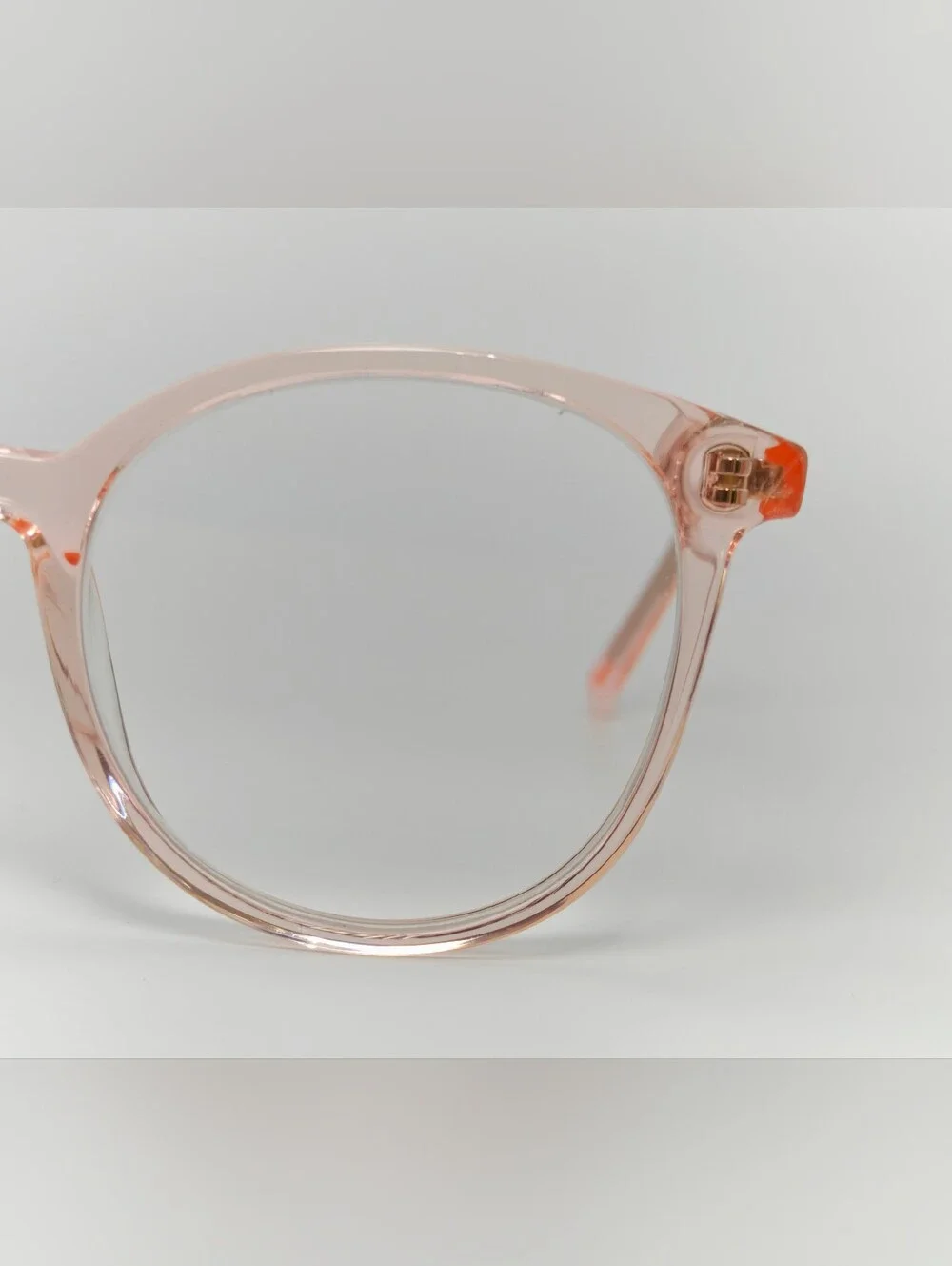 Noun. Transparent Pink Round Women's Eyeglasses. Minimalist..